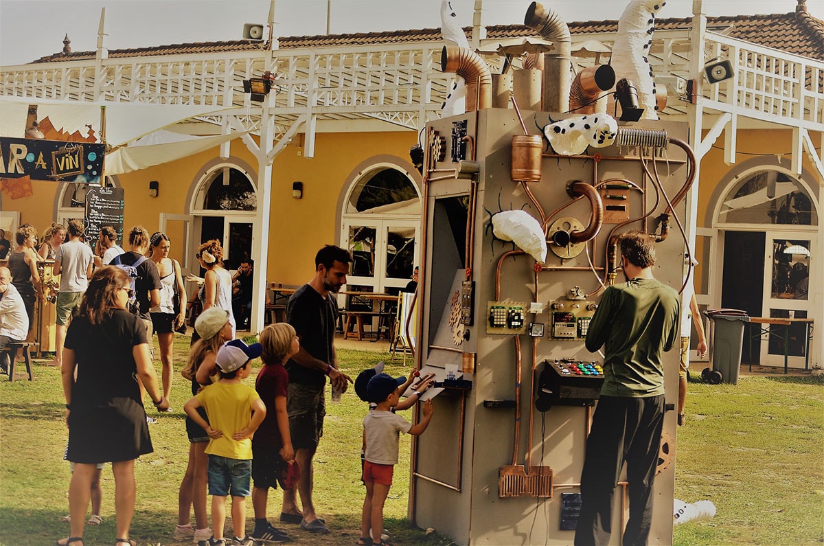Children queuing to play to game on the arcade machine during the festival